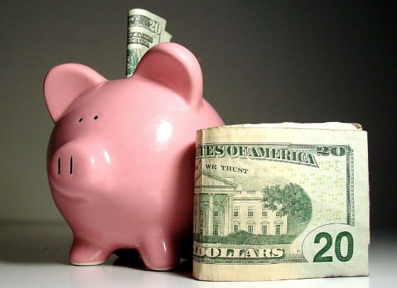 Pink piggy bank saving cash on health care.